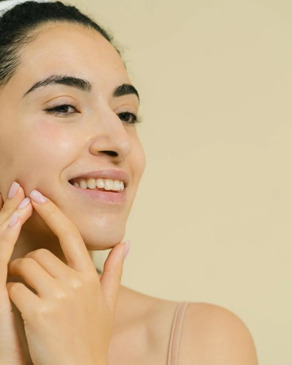A woman with radiant, healthy skin — welcoming, Spanish-speaking care at Aesthetics Universe Med Spa in Anaheim, CA